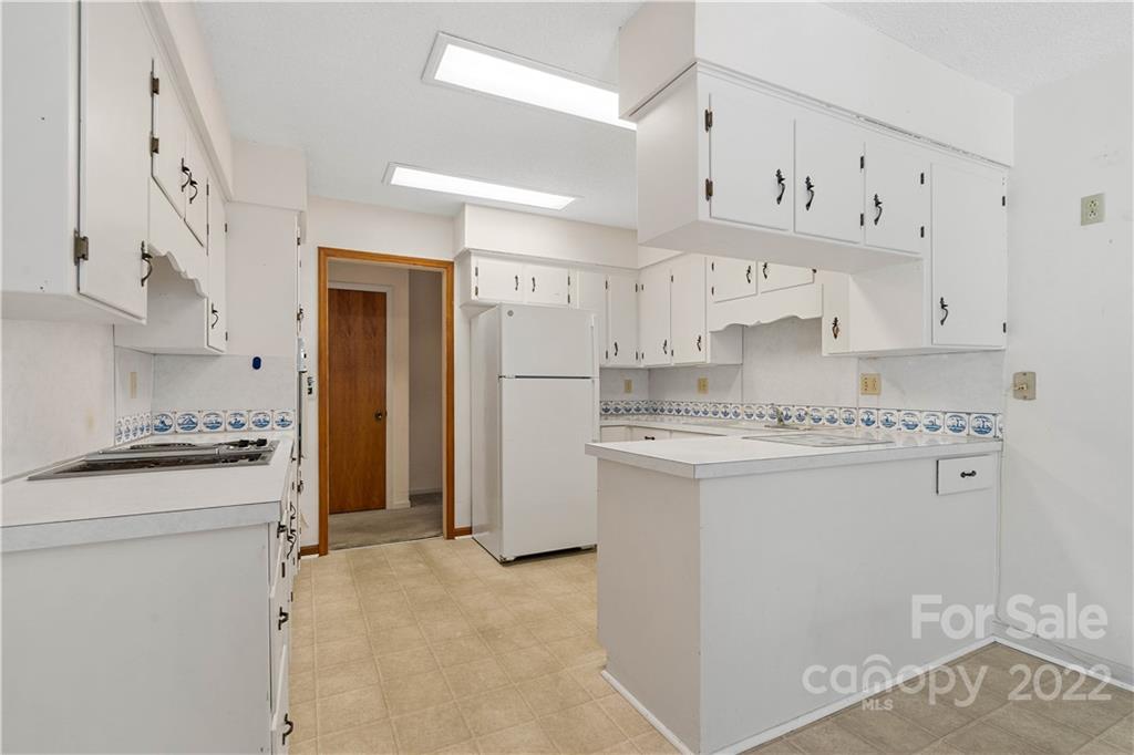 312 Brookside Drive Fort Mill, SC 29715 - Photo 12 of 23 a kitchen with cabinets appliances a sink and a stove