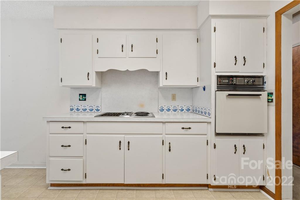 312 Brookside Drive Fort Mill, SC 29715 - Photo 14 of 23 a kitchen with white cabinets and sink