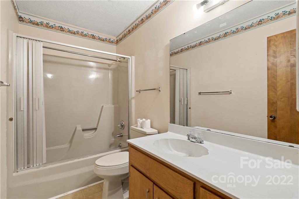 312 Brookside Drive Fort Mill, SC 29715 - Photo 17 of 23 a bathroom with a sink a toilet and shower