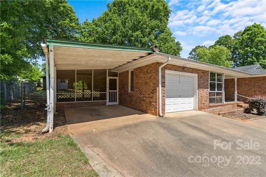 312 Brookside Drive Fort Mill, SC 29715 - Photo 2 of 23 a view of a house with a yard and potted plants