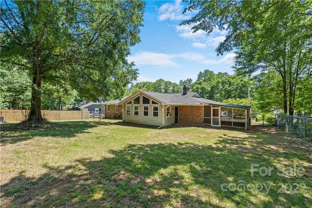 312 Brookside Drive Fort Mill, SC 29715 - Photo 5 of 23 a house with green field in front of it
