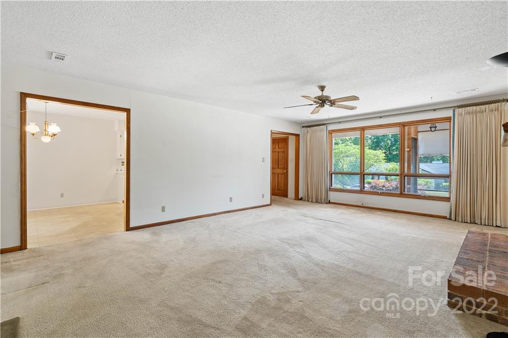 312 Brookside Drive Fort Mill, SC 29715 - Photo 7 of 23 an empty room with windows and ceiling fan