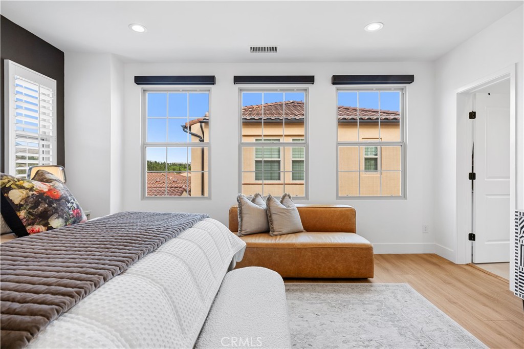 89 Kestrel Irvine, CA 92618 - Photo 14 of 36 a bedroom with furniture and windows