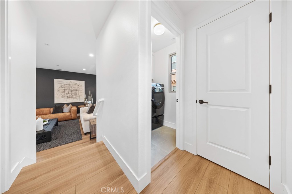 89 Kestrel Irvine, CA 92618 - Photo 16 of 36 a view of a room with wooden floor and furniture