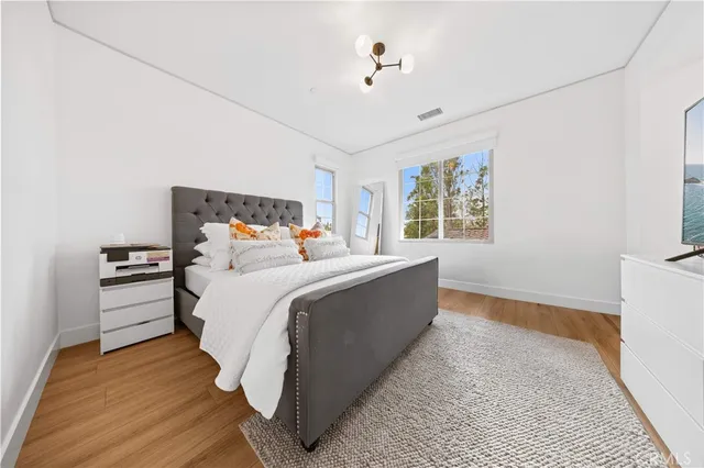 a bed room with a bed and a window