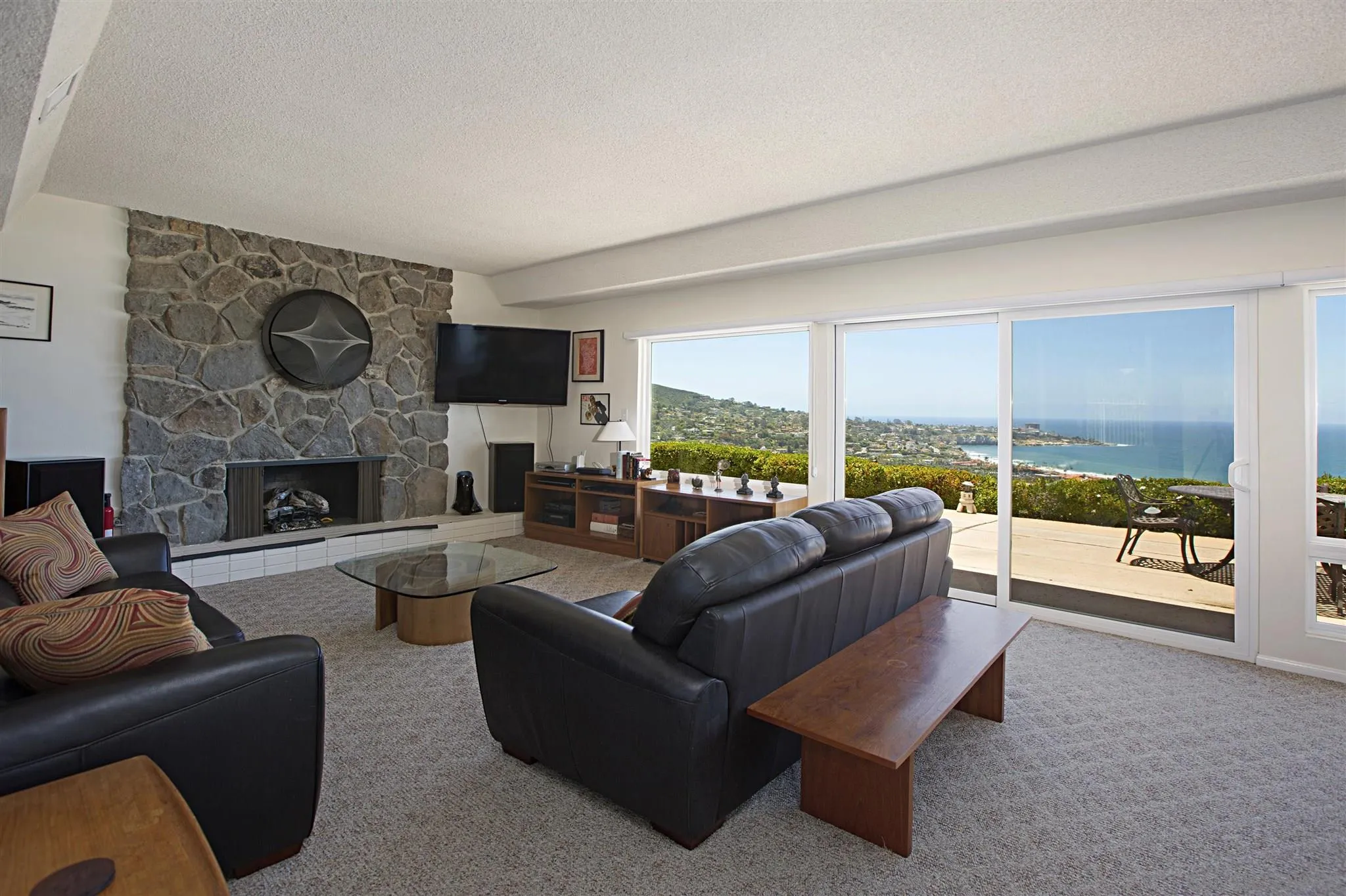 8330 Prestwick Drive La Jolla, CA 92037 - Photo 8 of 25 a living room with furniture and a fireplace