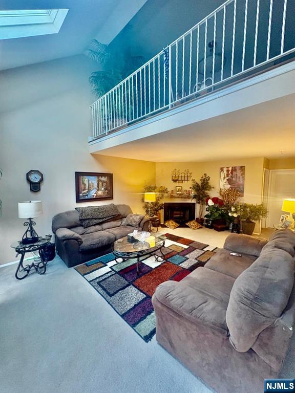 51 Beacon Hill Road, Unit C West Milford, NJ 07480 - Photo 12 of 31 a living room with furniture fireplace and a window