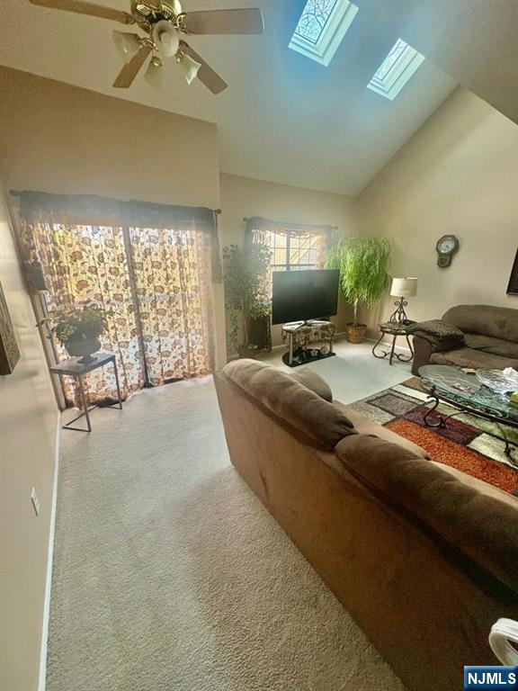 51 Beacon Hill Road, Unit C West Milford, NJ 07480 - Photo 17 of 31 a living room with furniture and a floor to ceiling window
