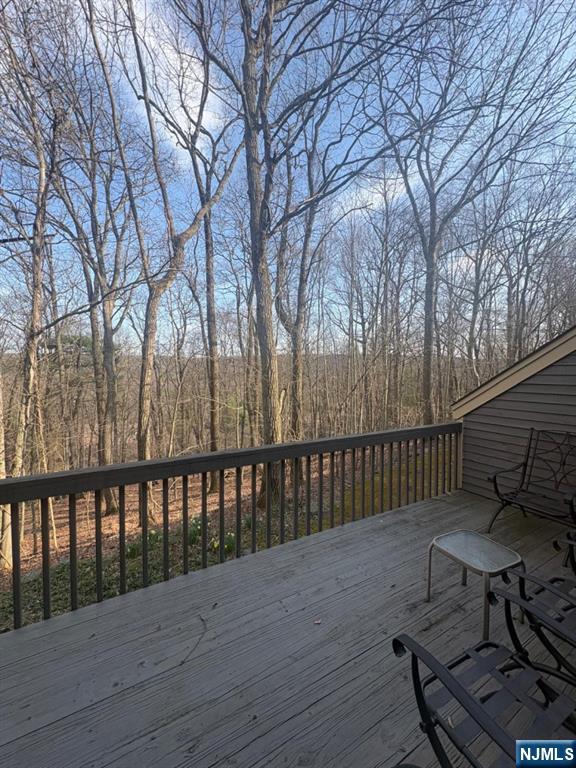 51 Beacon Hill Road, Unit C West Milford, NJ 07480 - Photo 19 of 31 a view of wooden deck with a bench