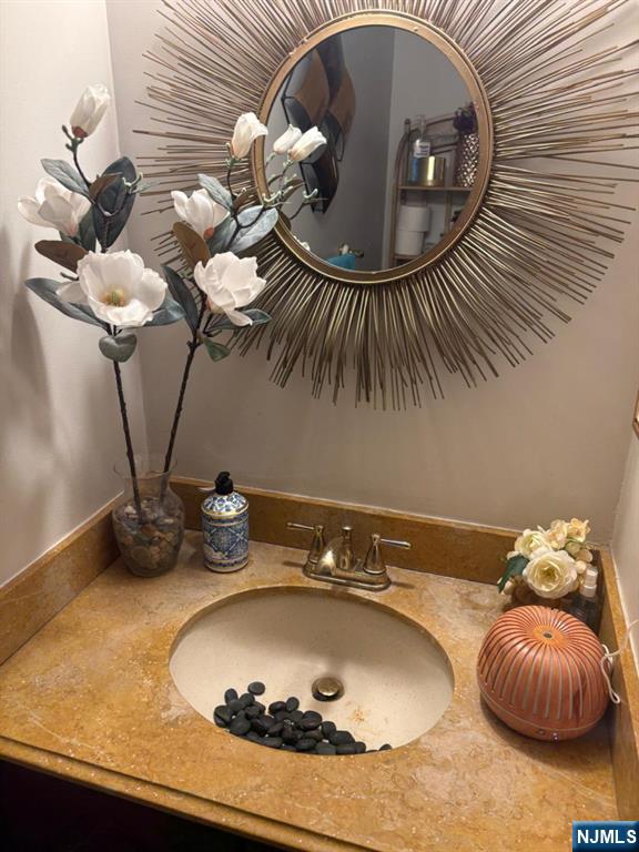 51 Beacon Hill Road, Unit C West Milford, NJ 07480 - Photo 21 of 31 a bathroom with a sink and mirror