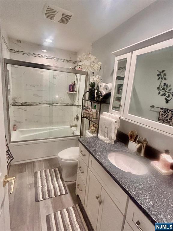 51 Beacon Hill Road, Unit C West Milford, NJ 07480 - Photo 24 of 31 a bathroom with a granite countertop sink toilet and shower
