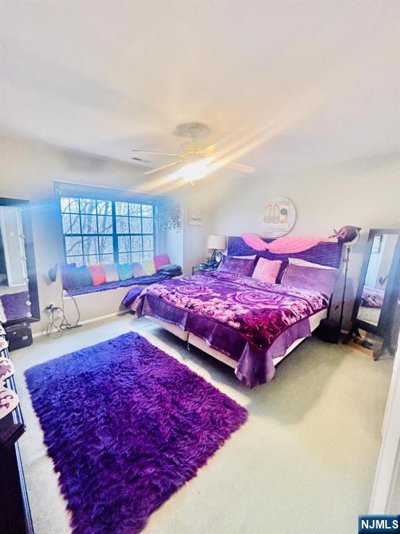 51 Beacon Hill Road, Unit C West Milford, NJ 07480 - Photo 25 of 31 a living room with a bed and a couch