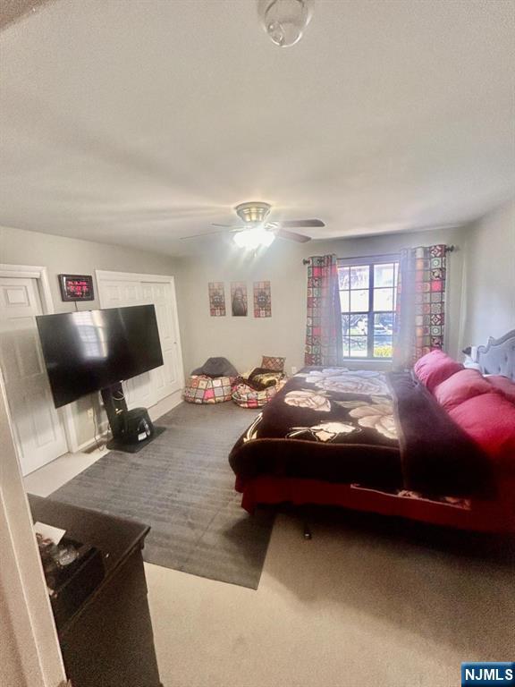 51 Beacon Hill Road, Unit C West Milford, NJ 07480 - Photo 28 of 31 a living room with furniture and a flat screen tv