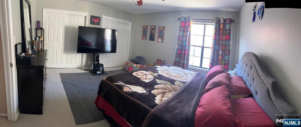 51 Beacon Hill Road, Unit C West Milford, NJ 07480 - Photo 29 of 31 a living room with furniture and a flat screen tv