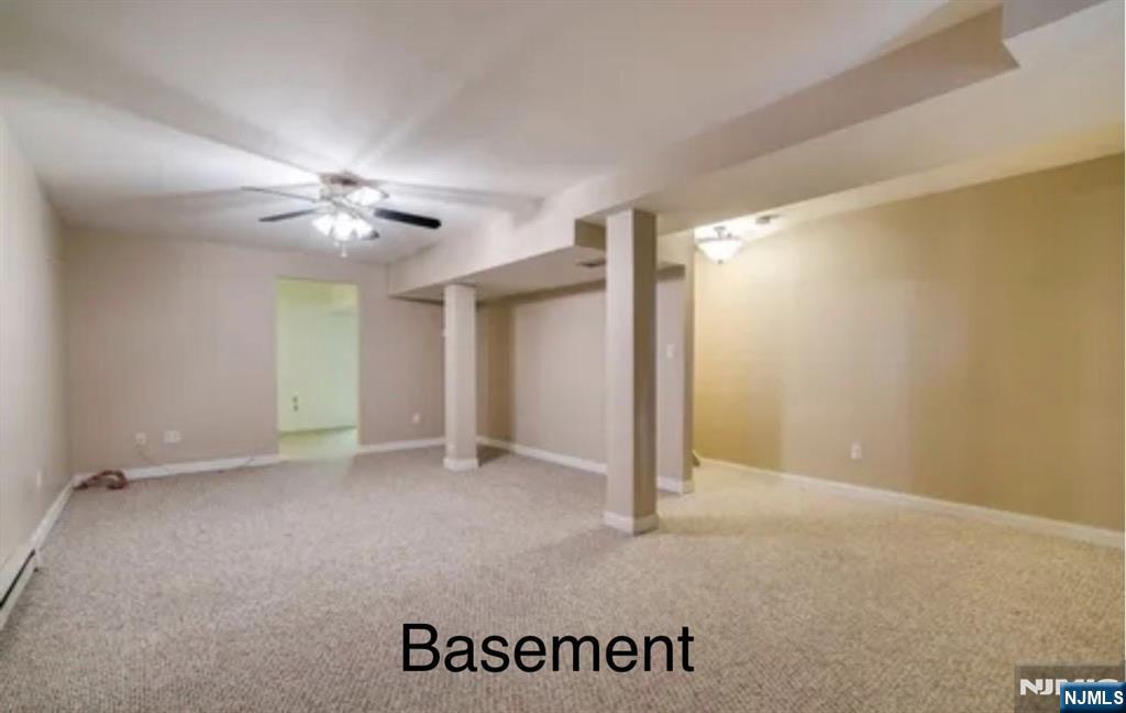 51 Beacon Hill Road, Unit C West Milford, NJ 07480 - Photo 30 of 31 an empty room with a ceiling fan and bathroom