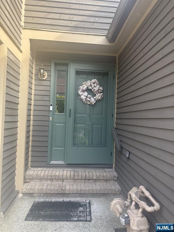 51 Beacon Hill Road, Unit C West Milford, NJ 07480 - Photo 3 of 31 a view of a entryway door front of house
