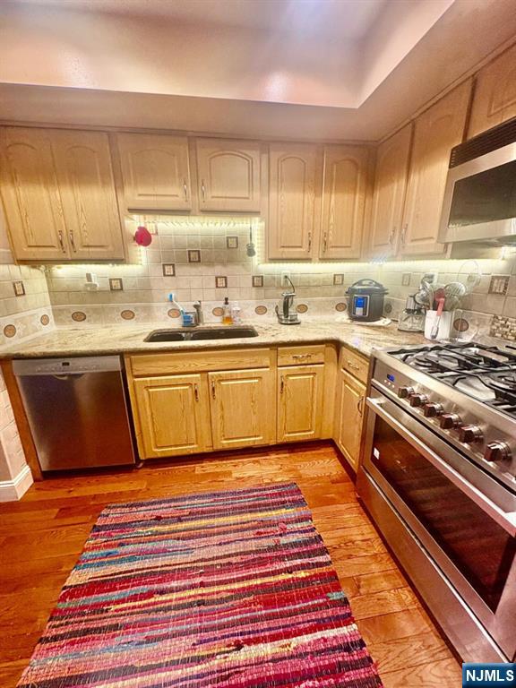 51 Beacon Hill Road, Unit C West Milford, NJ 07480 - Photo 7 of 31 a kitchen with stainless steel appliances granite countertop a sink stove and cabinets