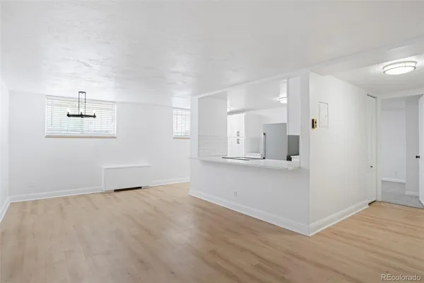 a view of kitchen with wooden floor