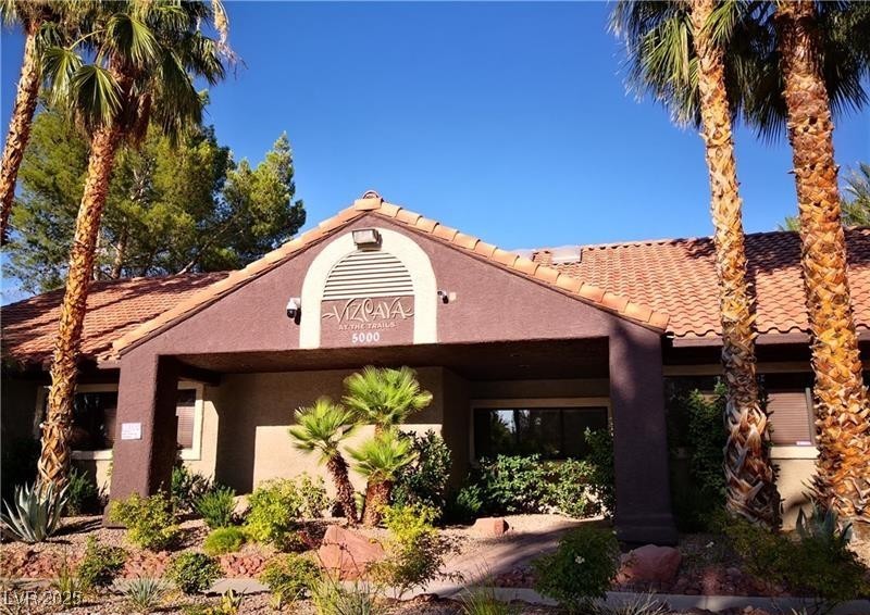 5026 South Rainbow Boulevard, Unit 203 Las Vegas, NV 89118 - Photo 2 of 31 View of front of house featuring stucco siding and a tiled roof
