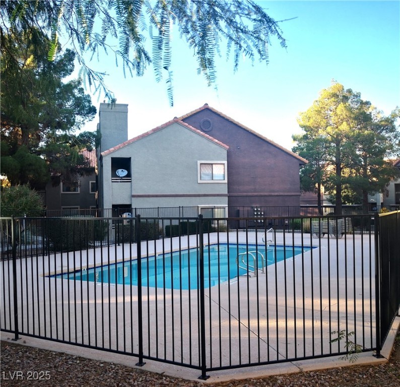 5026 South Rainbow Boulevard, Unit 203 Las Vegas, NV 89118 - Photo 28 of 31 Community pool featuring a patio area