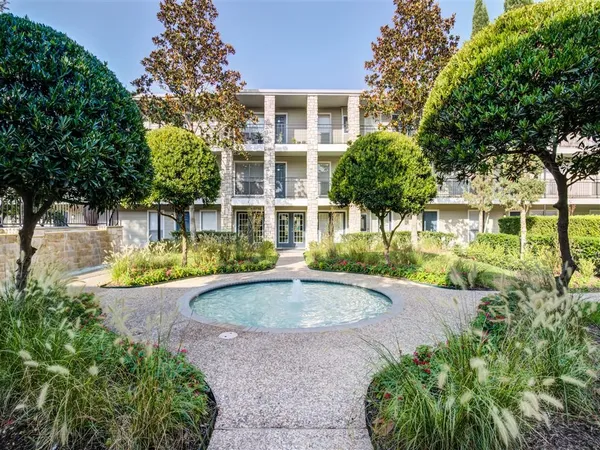 a view of a livingroom with furniture window and wooden floor