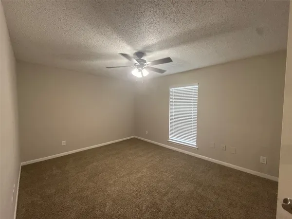 front view of a house with a garden