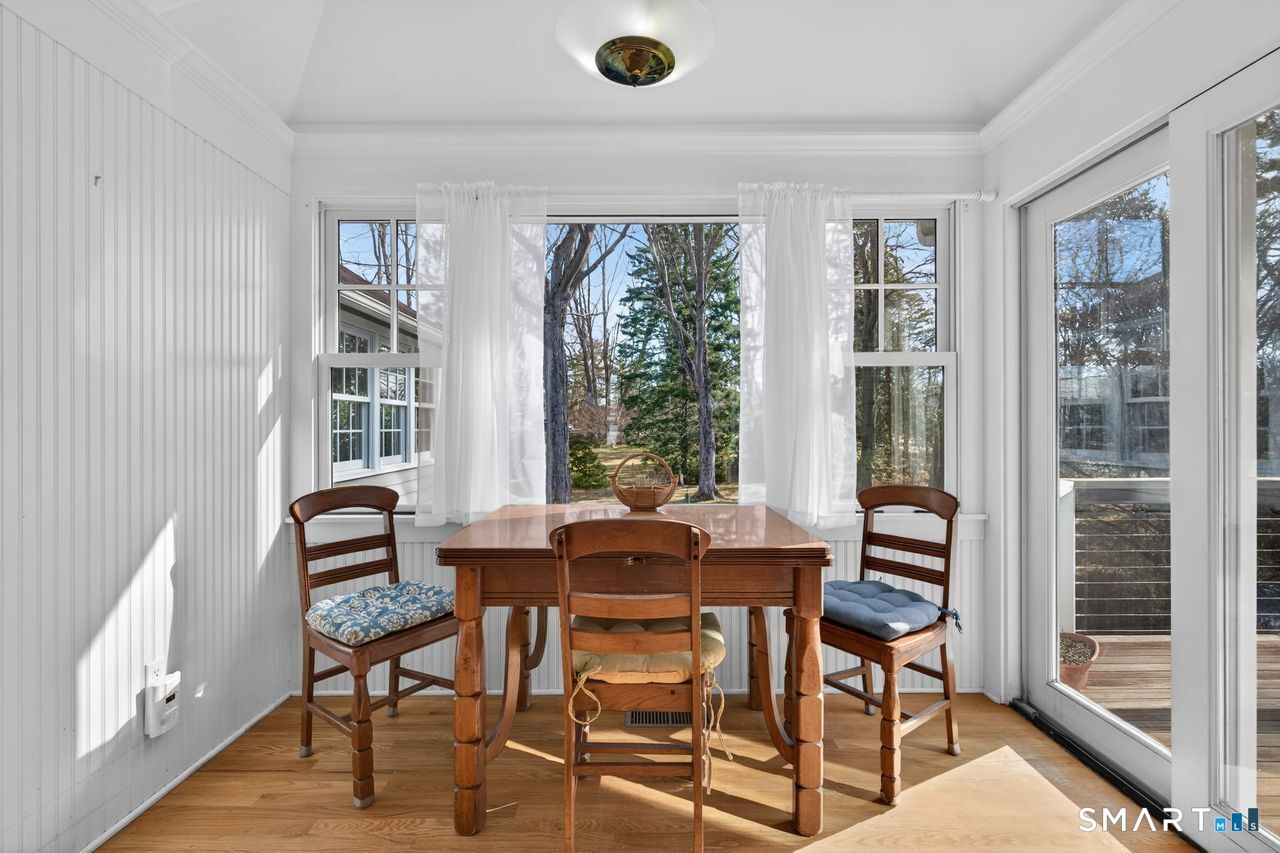 46 A Beach Avenue Madison, CT 06443 - Photo 11 of 32 a view of a dining room with furniture and windows