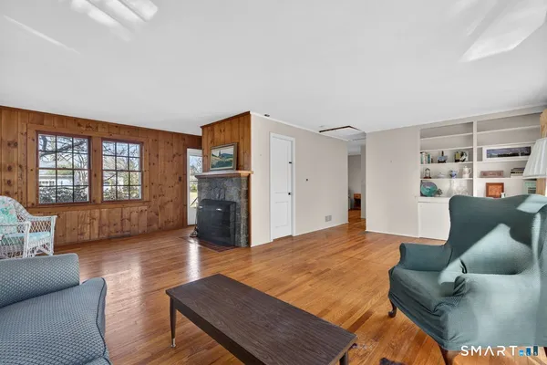 a view of a room with furniture window and wooden floor