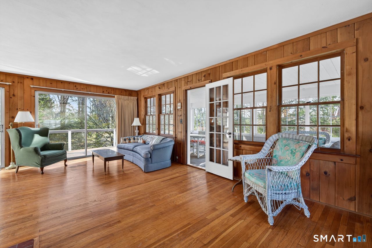 46 A Beach Avenue Madison, CT 06443 - Photo 18 of 32 a living room with furniture and a large window