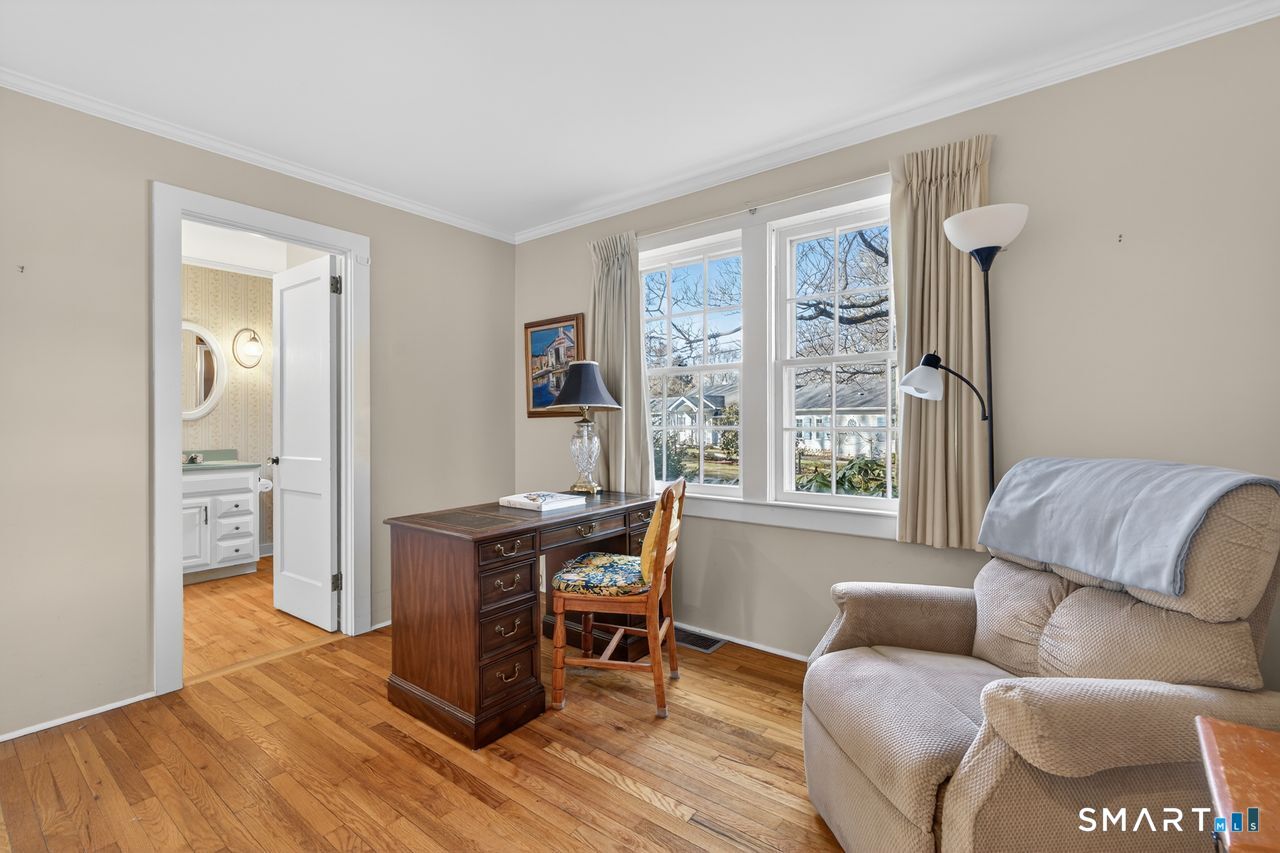 46 A Beach Avenue Madison, CT 06443 - Photo 31 of 32 a living room with furniture and a window