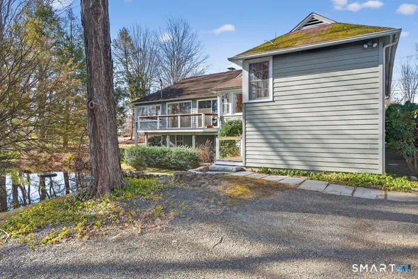 a open kitchen with stainless steel appliances granite countertop a stove and a refrigerator