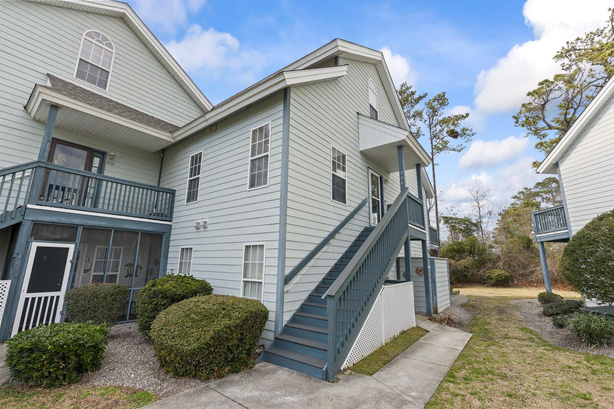4353 Spa Drive, Unit 909 Little River, SC 29566 - Photo 3 of 39 View of side of home with a sunroom and a balcony