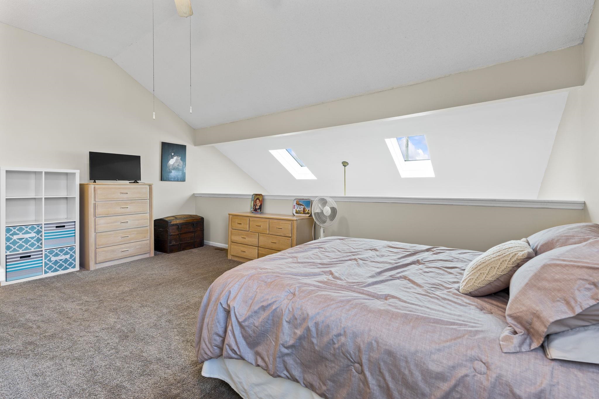 4353 Spa Drive, Unit 909 Little River, SC 29566 - Photo 29 of 39 Bedroom with a skylight, carpet floors, lofted ceiling, and ceiling fan