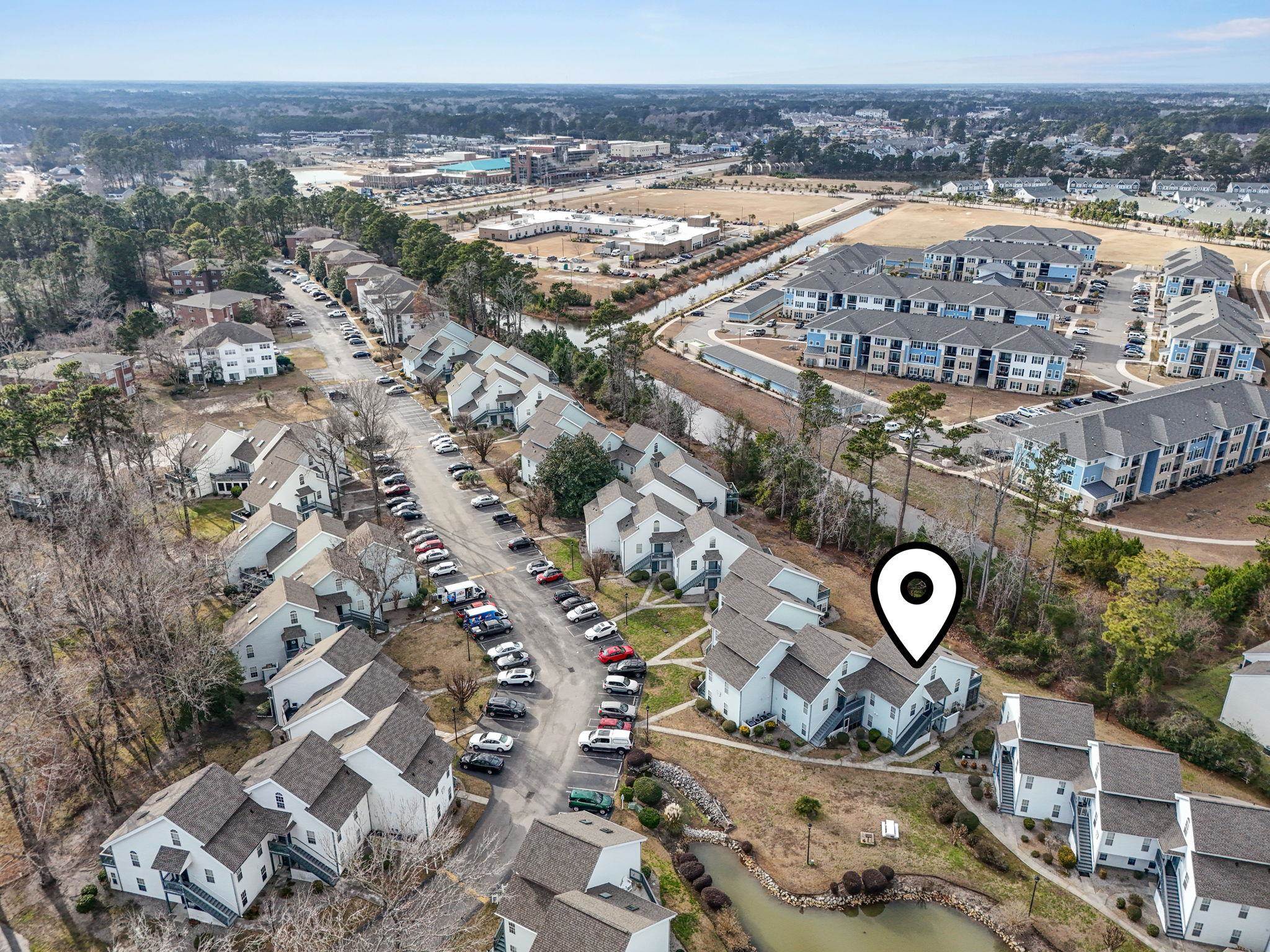 4353 Spa Drive, Unit 909 Little River, SC 29566 - Photo 36 of 39 Aerial view of property and surrounding area featuring nearby suburban area