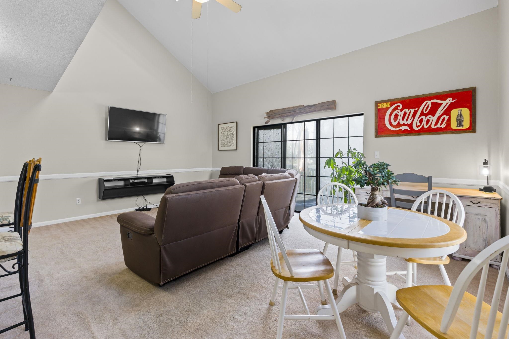 4353 Spa Drive, Unit 909 Little River, SC 29566 - Photo 8 of 39 Dining room featuring high vaulted ceiling, carpet, and a ceiling fan