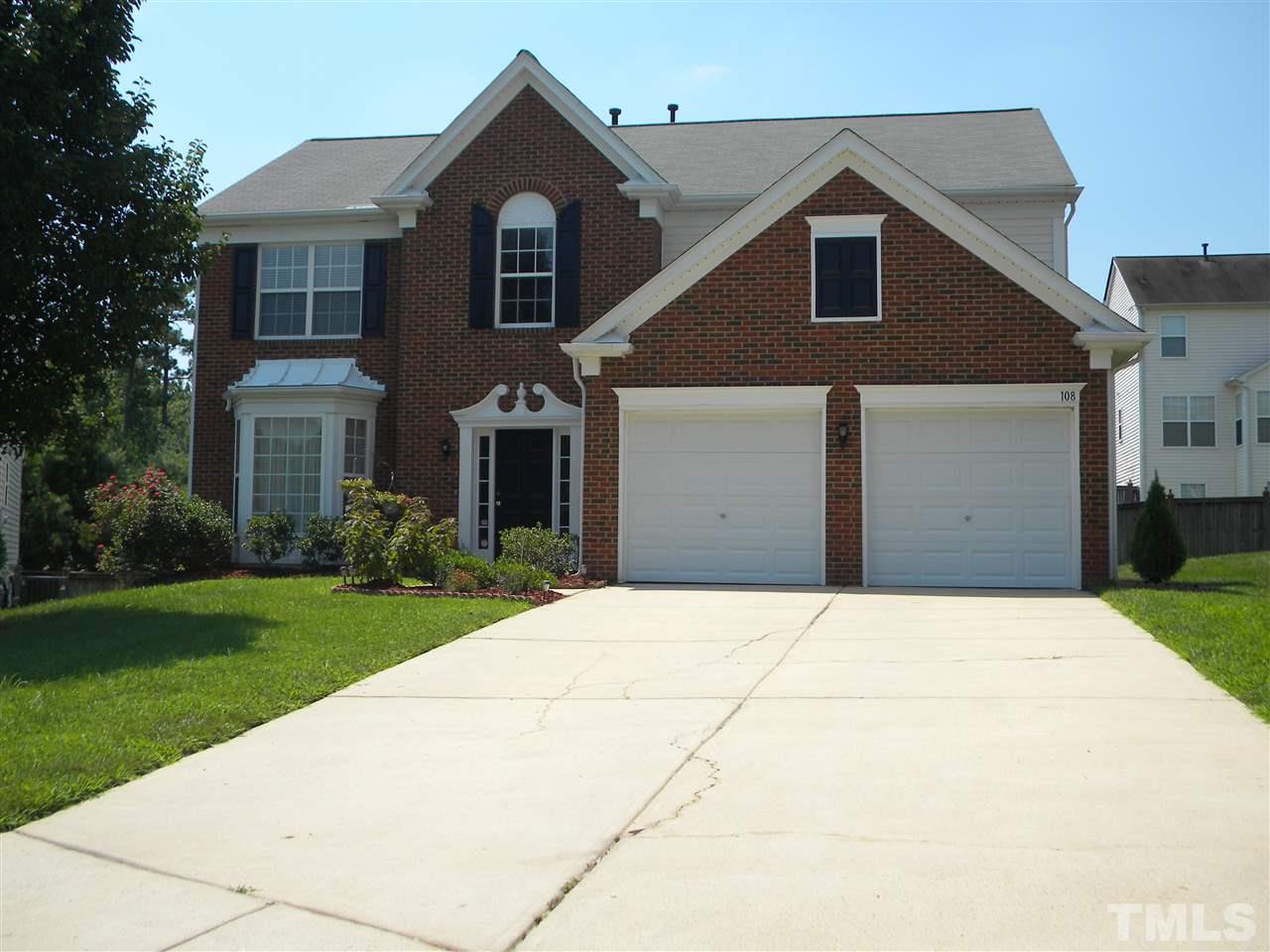108 Rock River Road Morrisville, NC 27560 - Photo 1 of 25 a front view of a house with a yard