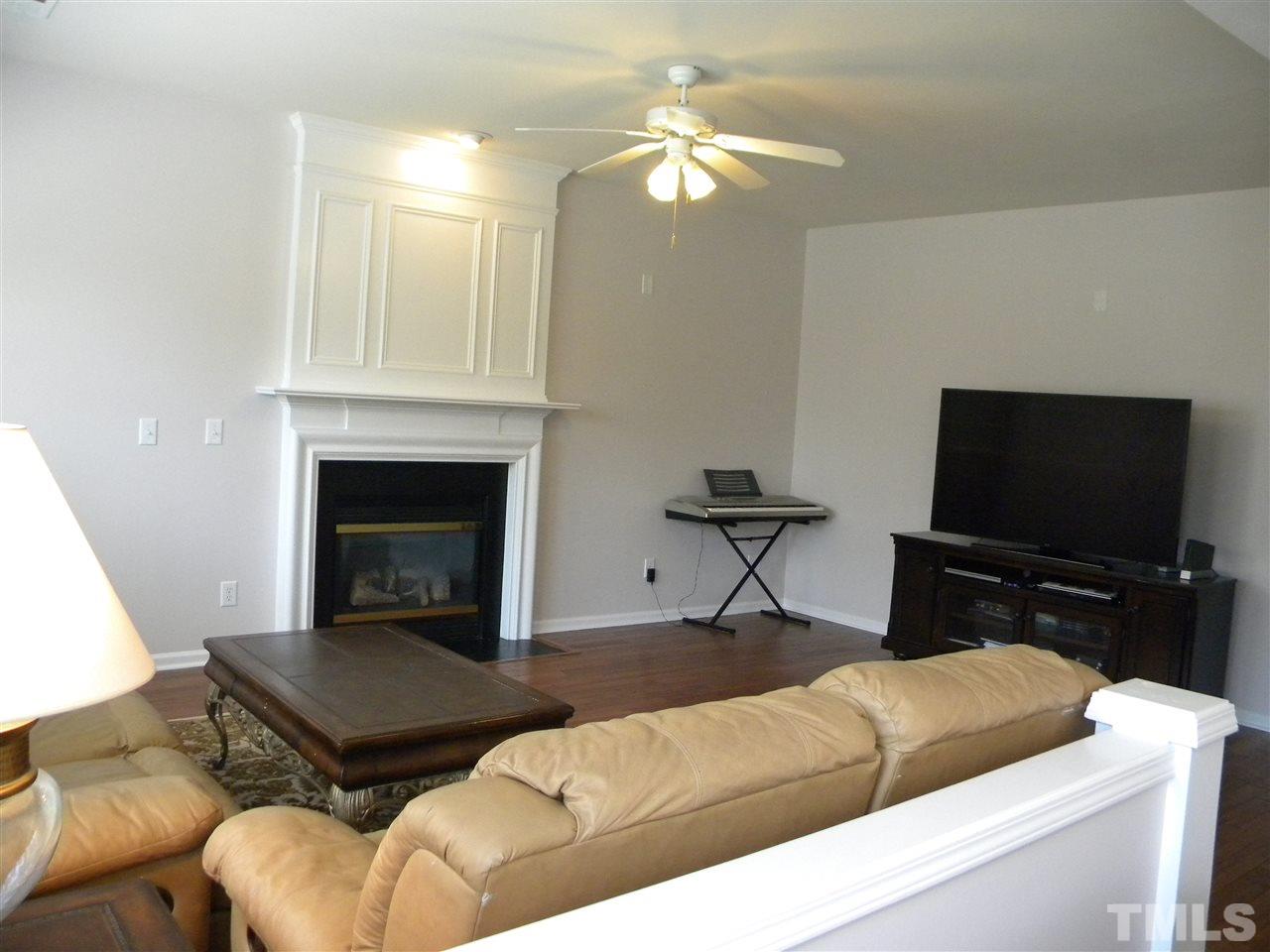108 Rock River Road Morrisville, NC 27560 - Photo 12 of 25 a living room with furniture and a flat screen tv