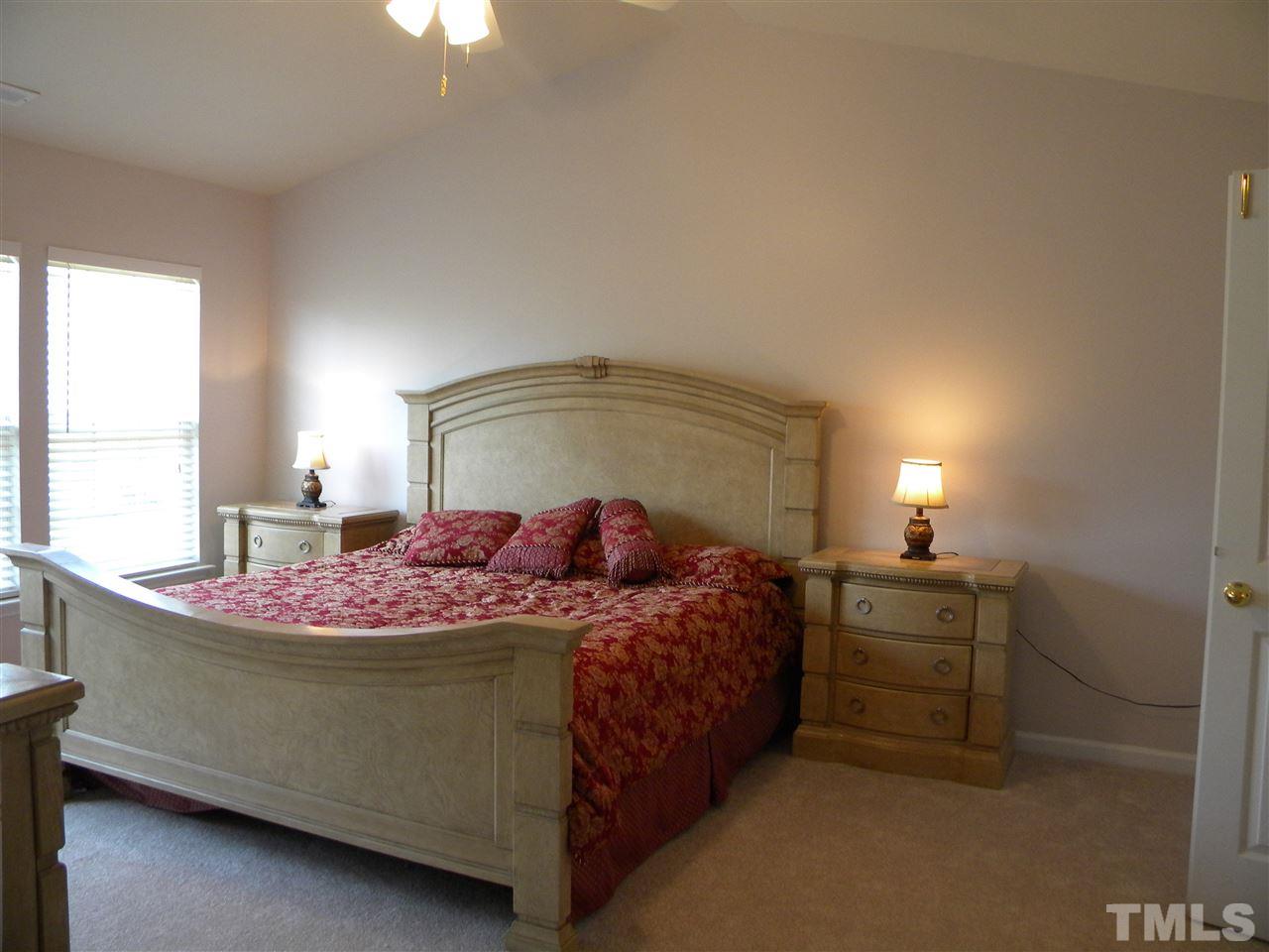 108 Rock River Road Morrisville, NC 27560 - Photo 14 of 25 a bedroom with a bed and window