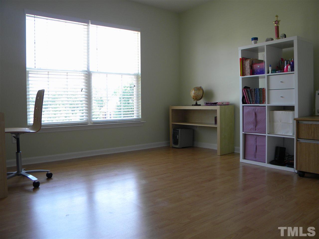 108 Rock River Road Morrisville, NC 27560 - Photo 20 of 25 a livingroom with a window and wooden floor
