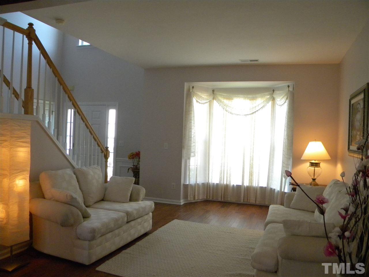 108 Rock River Road Morrisville, NC 27560 - Photo 7 of 25 a living room with furniture and a window