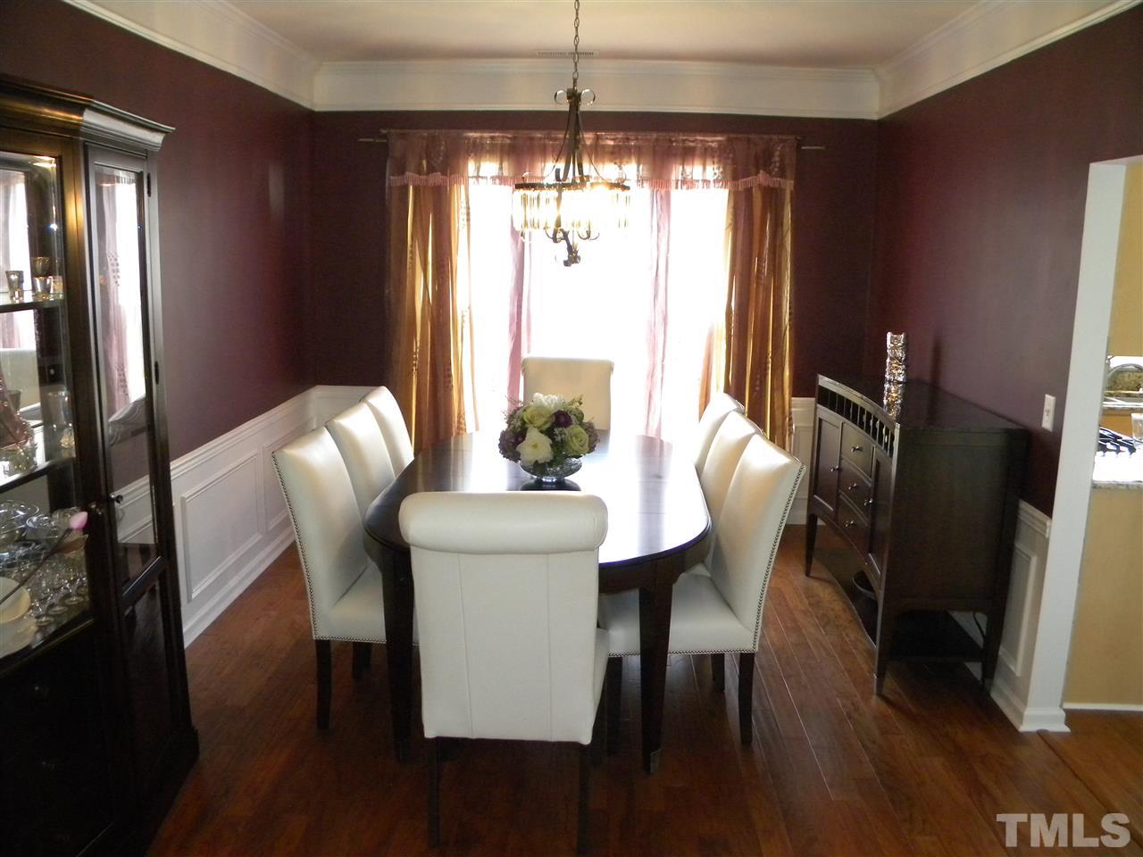 108 Rock River Road Morrisville, NC 27560 - Photo 8 of 25 a view of a dining room with furniture window and wooden floor