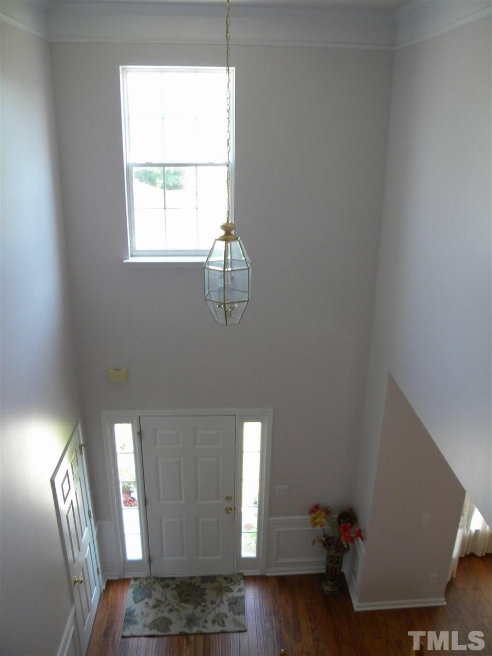 108 Rock River Road Morrisville, NC 27560 - Photo 9 of 25 a view of entryway and hall with wooden floor