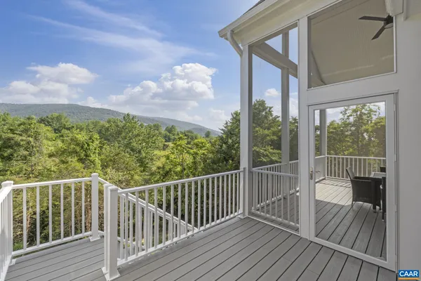 a kitchen with refrigerator a sink and chairs