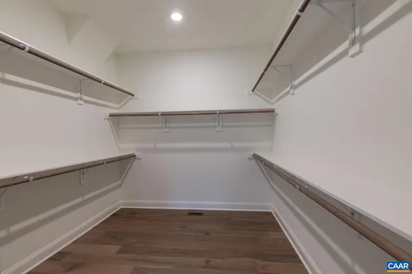 a workspace with wooden floor and closet