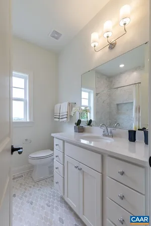a kitchen with stainless steel appliances granite countertop a stove and cabinets