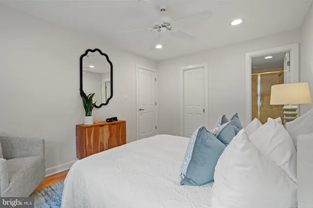 a bedroom with bed and window