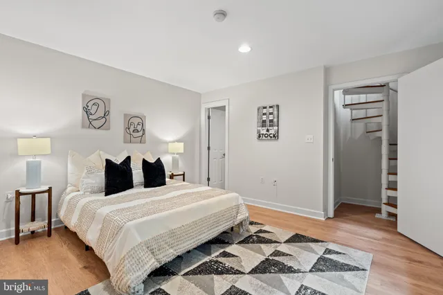 a bathroom with a sink toilet a mirror and shower