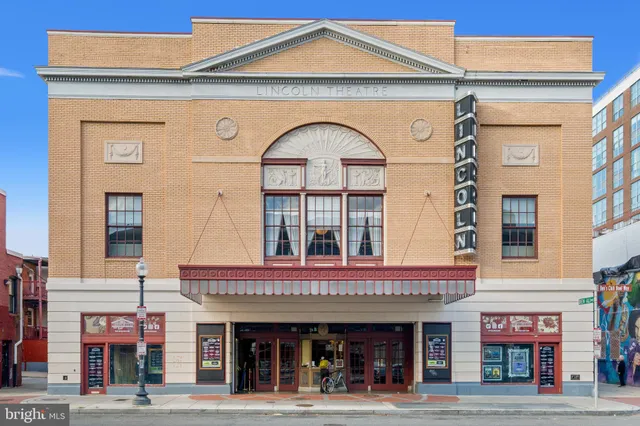 a view of a building with sitting area