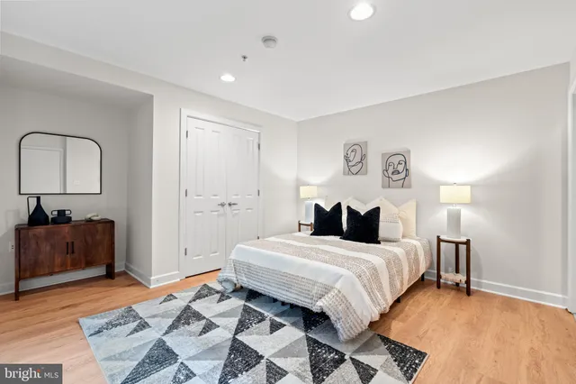 a bedroom with a bed and a dresser