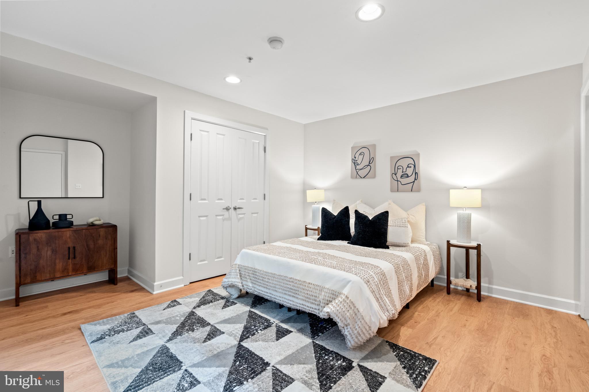 1421 Chapin Street Northwest, Unit 102 Washington, DC 20009 - Photo 6 of 37 a bedroom with a bed and a dresser